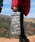 Person holding Go-To Hydration Bladder Carrier With 2 To 2.5L Water Reservoir, 600D Oxford Thermal Sleeve, in the mountains.