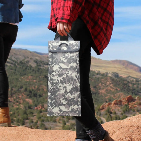 Person holding Go-To Hydration Bladder Carrier With 2 To 2.5L Water Reservoir, 600D Oxford Thermal Sleeve, in the mountains.