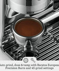 Oracle Fully Automatic Espresso Machine In Brushed Stainless Steel With 58 mm Portafilter Integrated Grinder And Slick Milk Frother For Top Shelf Home Brewing Setup Featuring Straight Up Essential Care Tools showing portafilter with ground coffee.