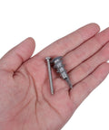 Close-up of Heavy Duty Zinc Alloy Drywall Anchor Kit With Self Drilling Screws 30 Pack in hand showing screw and anchor detail.