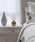 Hammered Gold Drip Table Lamp With White Fabric Shade Mini Size On Cord Switch 40W Type B Candelabra Bulb Not Included on nightstand