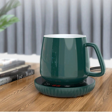 Tempered Glass Top Cup Warmer Pad With Digital Display And Auto Timer To Keep Your Morning Brew Piping Hot And Dodge The Cold Coffee Blues On Busy Weekdays with a green ceramic mug on a wooden table.