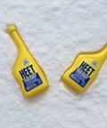 Water Removal and Gas Line Antifreeze for Winter Starts Keeps Your Fuel System Free of Water Prevents Gas Line Freezing and Rust Protection Plus Easy Starts in Cold Weather 12 Fl Oz yellow bottles on snow