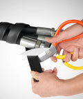 Person cutting Hydraulic Hose Protector Spiral Wrap, 2 Inch Outer Diameter, 10 Foot Length for machinery protection