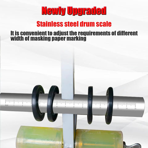 Stainless steel drum scale on adjustable shaft, with ruler markings and black rings for masking paper width adjustment
