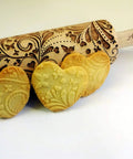 Beech Wood Embossed Rolling Pin With Butterflies And Flowers For Cookies And Crafts Handmade Kitchen Tool For Beautiful Patterns Ideal Gift For Mom Or Best Friend Great For Bakers And Hobbyists shown with heart-shaped embossed cookies