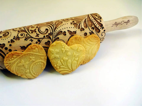 Beech Wood Embossed Rolling Pin With Butterflies And Flowers For Cookies And Crafts Handmade Kitchen Tool For Beautiful Patterns Ideal Gift For Mom Or Best Friend Great For Bakers And Hobbyists shown with heart-shaped embossed cookies