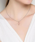 Model wearing Pink Hot Air Balloon Charm In Rose Gold Plating For Bracelets And Necklaces on a delicate chain