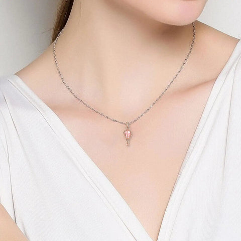 Model wearing Pink Hot Air Balloon Charm In Rose Gold Plating For Bracelets And Necklaces on a delicate chain