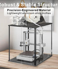 3D Printer Enclosure For Bambu Lab A1 With Fume And Odor Control, featuring black frame and clear panels on a wooden table.