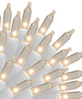 Close-up of Clear Warm White Outdoor Christmas String Lights On White Wire 150 Count Incandescent Mini Lights 120V UL Certified