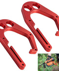 Pair of red aluminum tree climber hook with one-hand operation, compatible with Shem-biner XL, holding a chainsaw securely