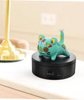 Levemolo Electric Rotating Turntable Display Stand For Jewelry And Watches 360 Degree Spin Base with colorful decorative figure on top.
