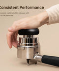 Ultimate Espresso Tamper Set For 58.4Mm Portafilters with user applying 30lb pressure on stainless steel tamper.