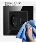 Smooth Touch Tempered Glass Wall Outlet Decked Out With Fast Charge USB Ports, easy-to-clean glass design with blue cloth.