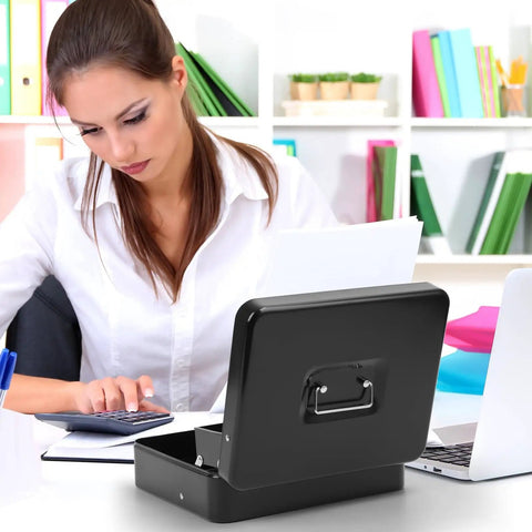 Woman using a calculator with a black Locking Cash Box With Key Lock and Cash Tray Heavy Duty Steel Money Safe Box open on a desk
