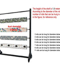 Heavy Duty Rolling Fabric Display Rack With Adjustable Cloth Roll Poles And Casters displaying fabric rolls and capacity guidelines