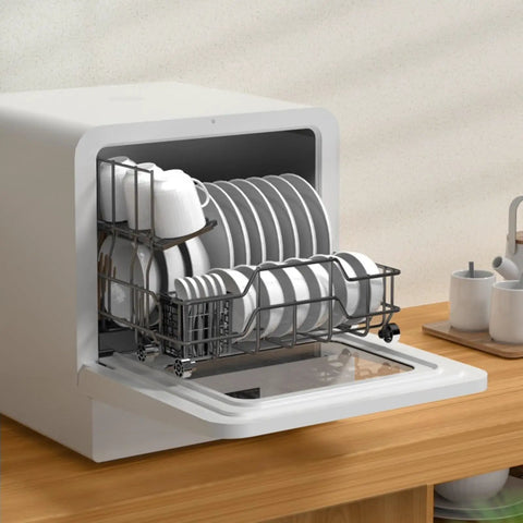 Super Compact Countertop Dishwasher No Stress Setup Smart Controls Triple Layer Filter Pull Out Basket For Crisp Clean Plates And Fast Loads Without Eating Shelf Space loaded with clean dishes on a wooden countertop.