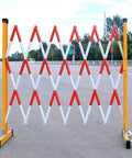 Tough As Nails Traffic Barricade Heavy Duty Industrial Crowd Control Barrier For Construction Zones And Large Gatherings Uv Resistant FRP Expandable Safety Fence Red White, showing expandable design in use.
