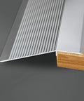 The Heavy Duty Aluminum Transition Strip 36 Inch Doorway Ramp Reducer For Wheelchair Thresholds Smooth Ride Aviation solid gray aluminum detail.