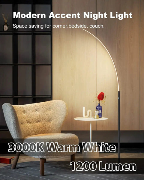 Arc Corner Floor Lamp With Curved LED Design And Touch Dimmer 3000K Warm White Glow Three Brightness Presets For Bedroom Or Living Room 63 Inch Tall 12W Black Modern Standing Lamp For Cozy Moody Vibes beside chair.