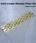 12 Inch Linear Shower Drain With Removable Brickwork Pattern Grate Adjustable Feet Hair Catcher Brushed Gold Finish