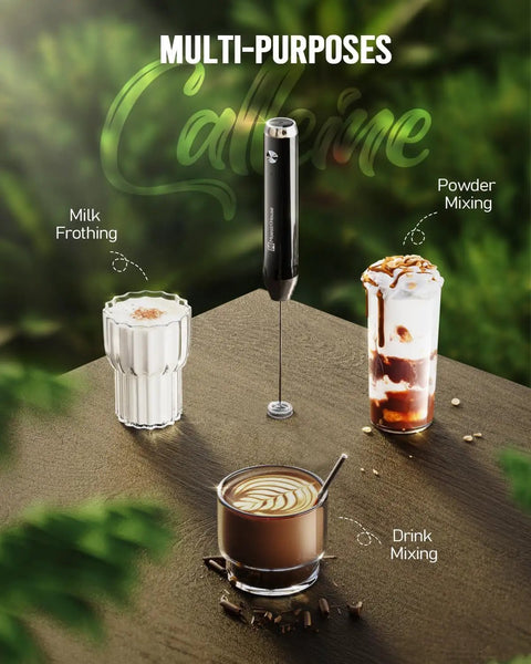 Rechargeable Handheld Milk Frother LunaFro NS Electric Foam Maker with detachable stainless steel whisk between drinks on table.