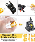 Dual Use Hydraulic Brake Bleed Kit For Road And MTB Bikes With M4 To M7 Adapters shown with brake caliper