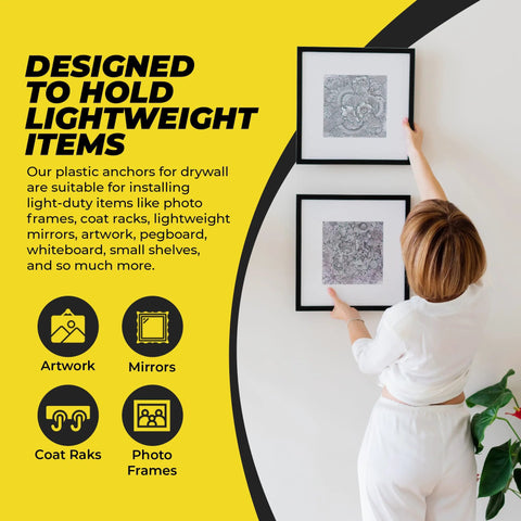 Person installing frames on drywall with ribbed plastic drywall anchors for secure wall fastening in drywall projects bulk pack of expandable split body anchors for drywall size six to eight by seven eighths inch easy to install with no spinning visible in background.