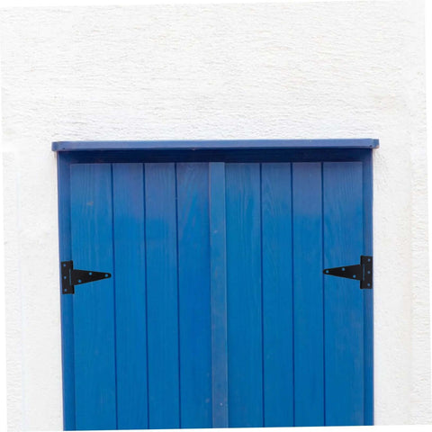 Front view of blue wooden outdoor shed door with black heavy-duty hinges and vertical planks