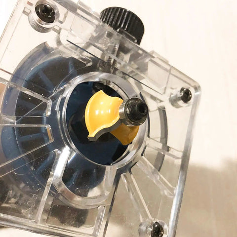 Close-up of carbide router bit in use, part of Durable Carbide Router Bit Set With Anti Kickback, 12 Pieces, Half Inch Shanks.