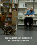 Man using O'Pen 3 EDC Pen Light Go-To 4 in 1 Bolt Action with green beam pointing at floor for cat interaction.