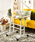 Adjustable Height Steel And Wood Mobile Standing Desk With Smooth Gliding Wheels Serves As Premium Laptop Table And Breakfast Tray Top Shelf Build That Hits Different For Remote Work Vibes Moves Like Butter in cozy living room setting.