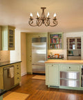 Rustic 8 Light Candle Chandelier In Vintage Iron With French Country Charm Farmhouse Pendant Light in kitchen setting.