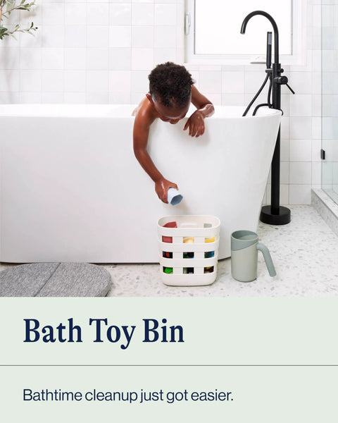 Child placing toy into Bathtime Storage Bin For Baby Essentials Non Toxic Plastic Organizer With Removable Drying Bin Wall Mount