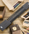 Slick Miniature Dovetail Template And Bit Kit on workbench, showing 1/4 dovetail router bit set with finger joint guides and wood pieces.