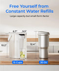 Electric Water Filter Pitcher With Rechargeable Instant Dispenser, Fifteen Cup Capacity, beside a 30 oz tumbler on countertop.