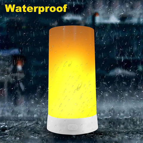 Rechargeable LED Flame Effect Light With Four Modes For Outdoor Hanging Camping Lantern in rain showing waterproof feature
