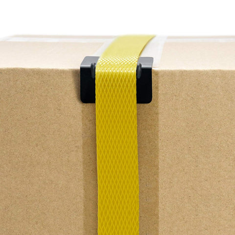 Heavy Duty Black Plastic Corner Protectors For Shipping Straps And Pallet Edges securing a yellow strap on cardboard box