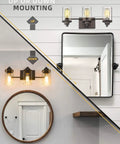 Three Light Farmhouse Vanity Light Fixture For Bathroom Wall Mount In Oil Rubbed Bronze With Clear Glass Shades, Durable Metal Build, Modern Rustic Lighting To Elevate Your Space And Up Your Bathroom Vibe, showcasing up or down installation options above mirrors.