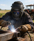 Kickass Auto Darkening Welding Goggles Solar Powered Wraparound Safety Eyewear used during TIG welding on metal beam.