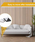Heavy Duty Self Adhesive Furniture Sliders 12 Pack Quick Stick Eva Foam Moving Pads on a sofa for easy relocation.