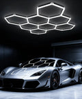 Installed Eight Grid Honeycomb Hexagon LED Garage Light 245W Ultra Bright 6500K Cool White illuminating a garage with a car.