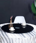 360 Degree Rotating Lazy Susan Turntable for Dining Tables and Kitchen Countertops Black Tempered Glass Base on table