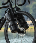 Front Fork Cage For Mountain Bikes, Solid Plastic Bottle Mount With Easy Installation Kit on a bike wheel