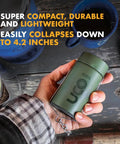 Hand holding Candle Lantern Value Pack With 3 Candles And Storage Bag Original Size Powder Coated Aluminum Forest Green Collapsible Camp Light.