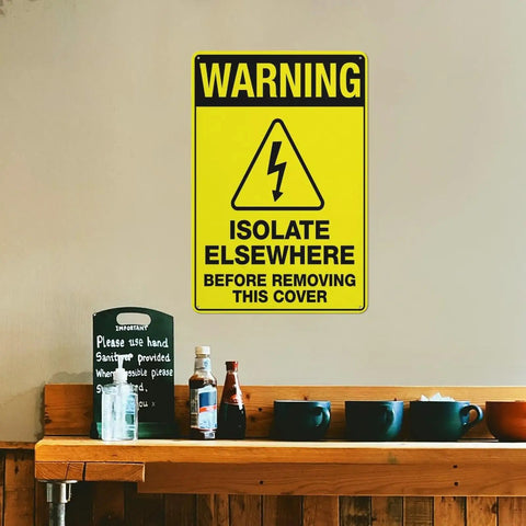 Heavy Duty 8x12 Workshop Safety Sign For Industrial Equipment Maintenance Zone Outdoor Wall Mount Plaque Rust Free UV Printed Aluminum With 4 Pre Drilled Holes on beige wall above a counter with bottles and cups.