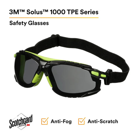 3M™ Solus™ 1000 TPE Series safety glasses with anti-fog coating. Lightweight, black and green design for industrial use.