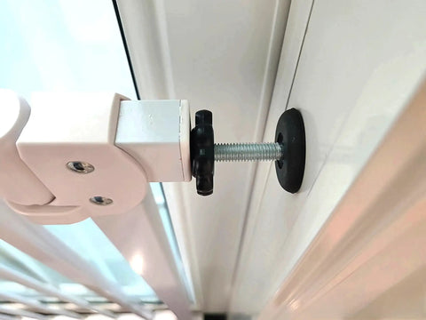 Close-up of M8 threaded tension bolt installed in door frame, part of 4 Pack Heavy Duty Threaded Spindle Rods Tension Bolts M8 Replacement Hardware Kit For Baby And Pet Safety Gates.