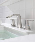 Waterfall Widespread Two-Handle Bathroom Faucet With Metal Pop Up Drain And Quick Connect Supply Lines In Oil Rubbed Bronze, No Fuss Install, 6 To 12 Inch Center Spread, Three Hole Mount, Doris 14071 on a white sink